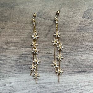 Gold and white diamond daisy dangle earrings